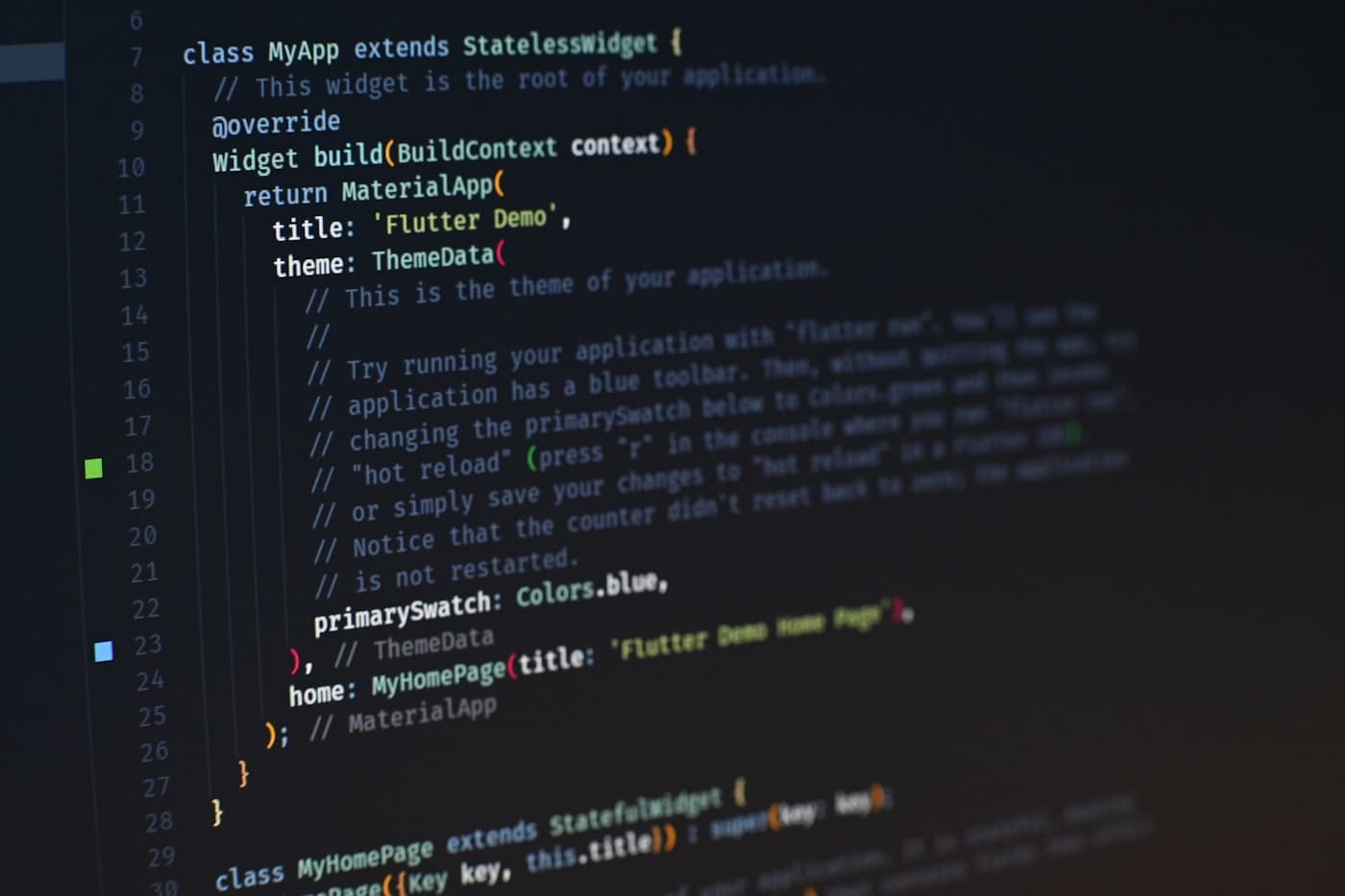 Close-up of Flutter/Dart mobile app code on a dark editor screen