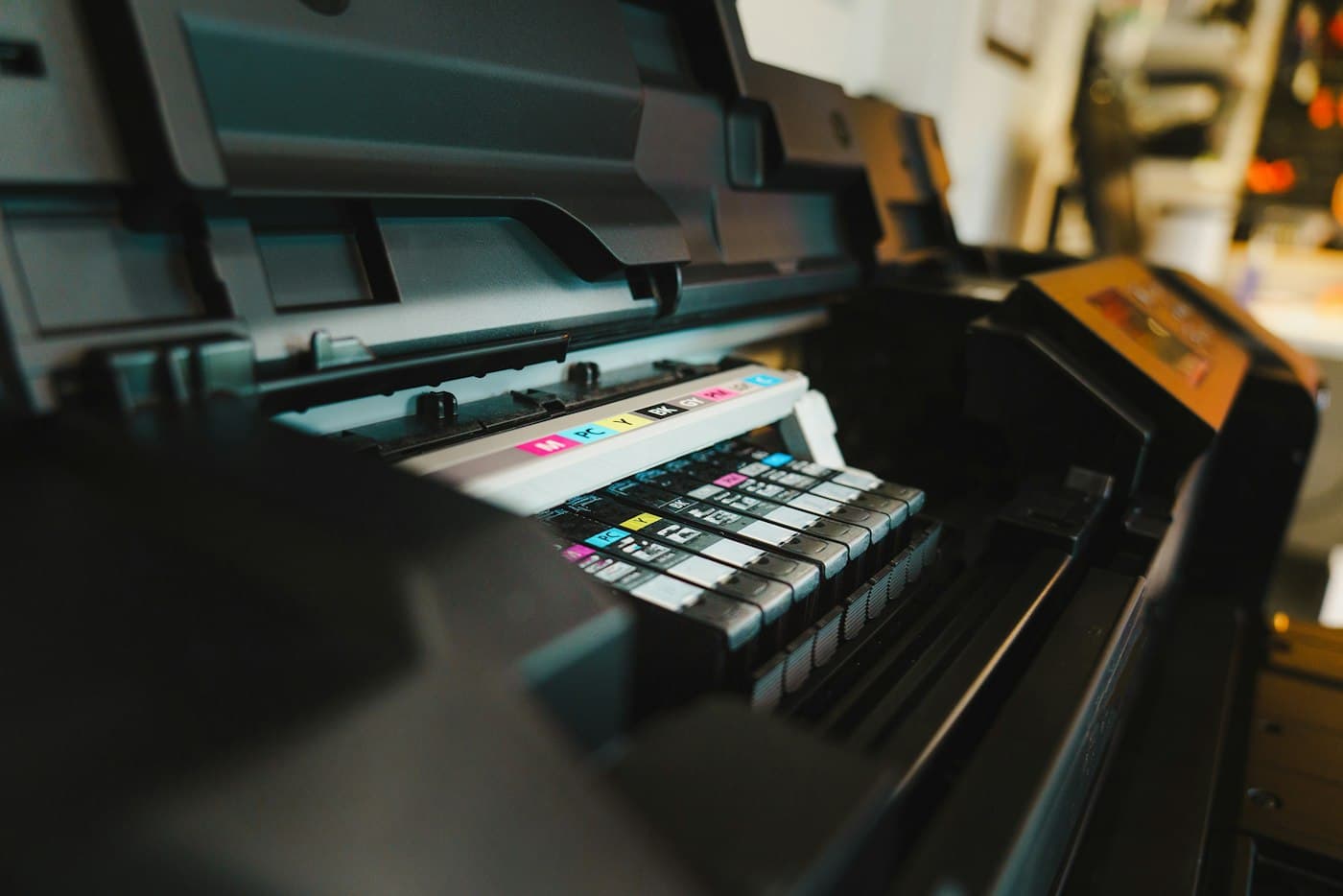 Close-up of printer ink cartridges, representing generated PDF reports