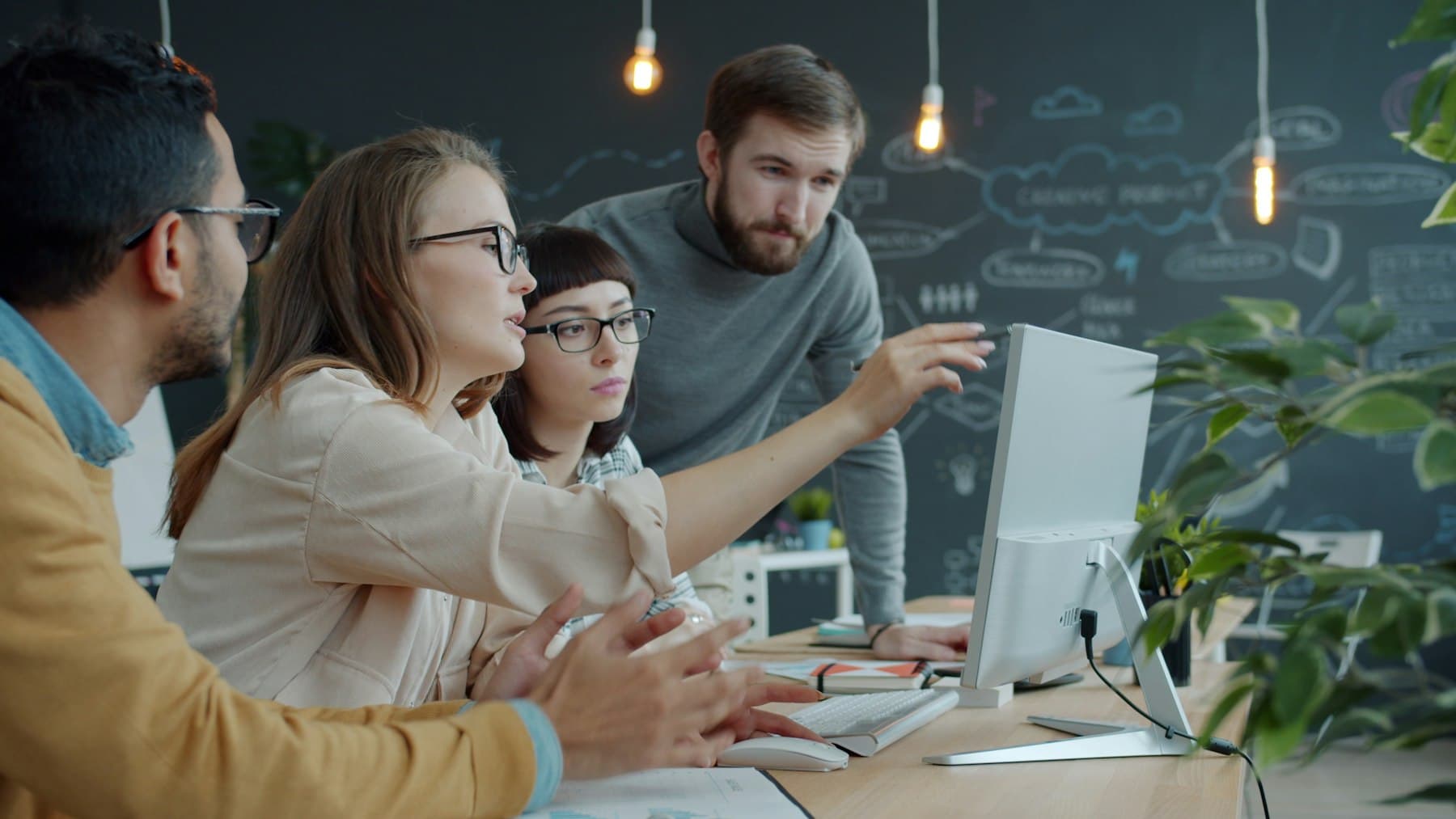 A team working through a technical problem together